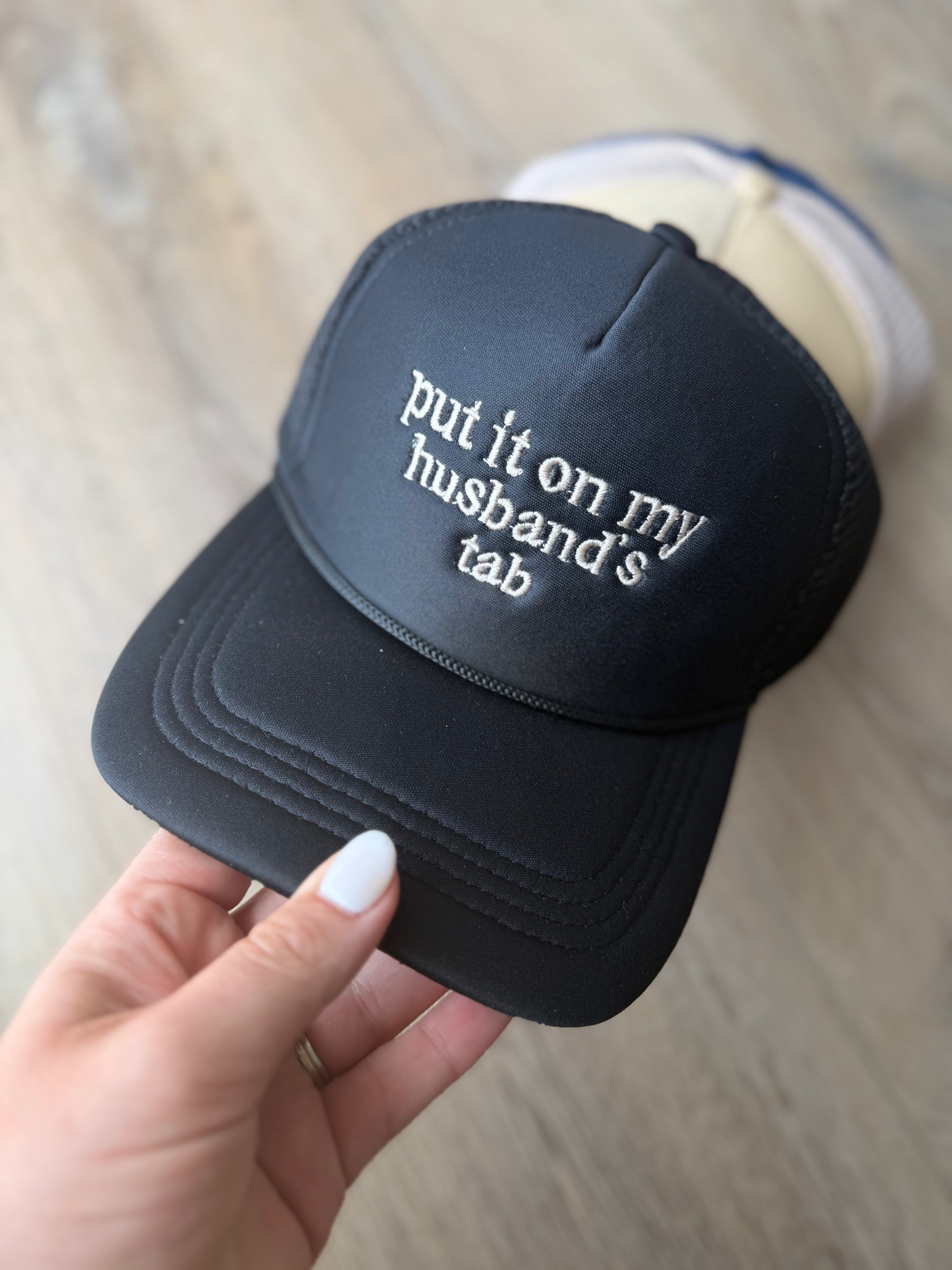 Put It On My Husband’s Tab Mesh Trucker Cap